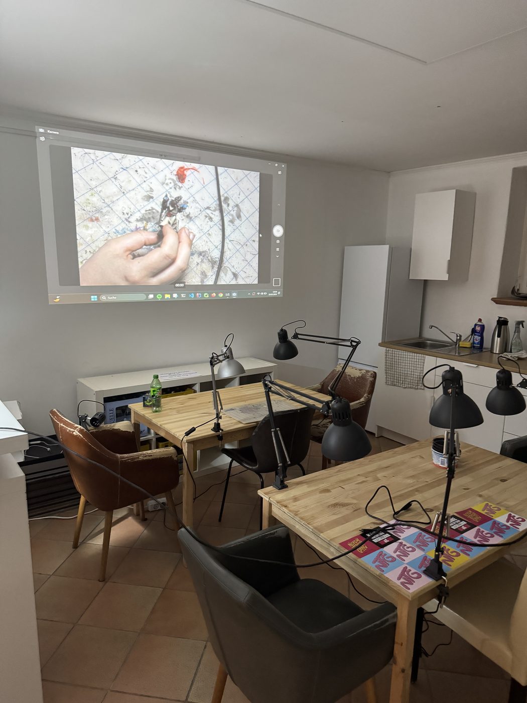 Members painting miniatures together at a Legio Intermeratus painting workshop in Augsburg